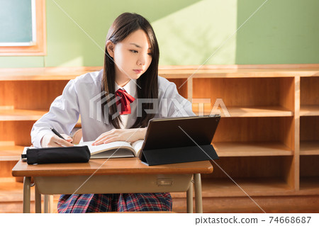 High school girls studying on tablets High school students 74668687
