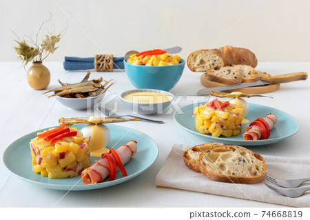 Henri Egg, tasty fresh brunch or snack. Henri Egg, tasty brunch or snack. Boiled eggs and smoked sprats fish with mayonnaise, ham and potato salad. White wooden table, no people. Henri Egg, tasty fresh brunch or snack. Henri Egg, tasty brunch or snack. Boiled eggs and smoked sprats fish with mayonnaise, ham and potato salad. White wooden table, no people. 74668819