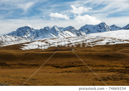 snowy mountain peaks on the Ala Bel pass 74669334