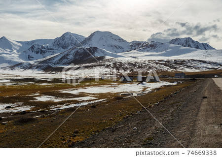 snowy mountain peaks on the Ala Bel pass snowy mountain peaks on the Ala Bel pass 74669338