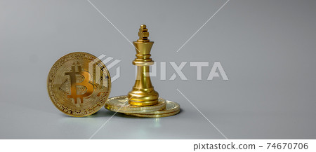 golden Bitcoin cryptocurrency coin stack and Chess King piece, Crypto is Digital Money within the blockchain network, is exchanged using technology and online internet exchange. Financial concept 74670706