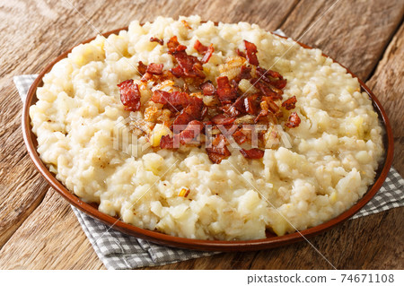 Estonian national dish Mulgipuder or potato pearl barley porridge. close-up in a plate. horizontal Estonian national dish Mulgipuder or potato pearl barley porridge. close-up in a plate. horizontal 74671108