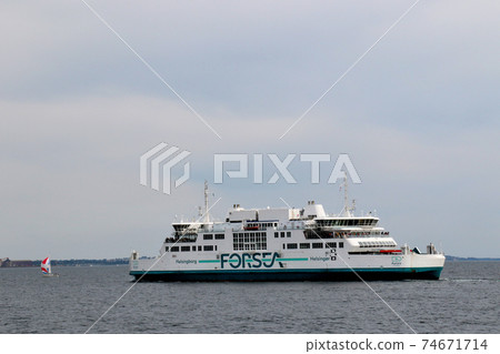 Kronborg Castle A ferry that goes through the strait facing the famous castle of World Cultural Heritage, which is built on the outskirts of Copenhagen, Denmark. Kronborg Castle A ferry that goes through the strait facing the famous castle of World Cultural Heritage, which is built on the outskirts of Copenhagen, Denmark. 74671714