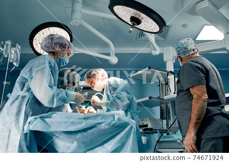 A team of surgeons is fighting for life, for a real operation, for real emotions. The intensive care team is fighting for the life of the patient. Saving life, the struggle for life 74671924