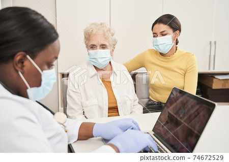 Doctor hearing about patient problems with health Doctor hearing about patient problems with health 74672529