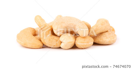 Cashew nuts isolated on white background. Roasted cashew nuts. Cashew nuts isolated on white background. Roasted cashew nuts. 74674070