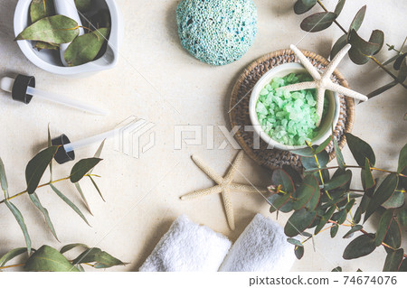 Healthcare concept with fresh eucalyptus leaves, salt and oil on stone background Healthcare concept with fresh eucalyptus leaves, salt and oil on stone background 74674076