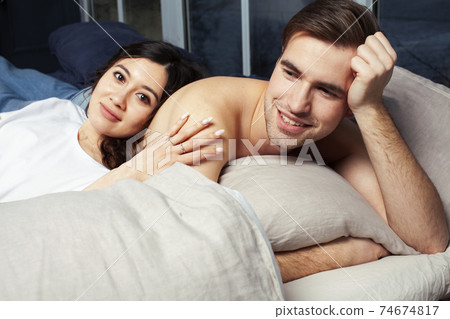 young pretty couple together in bed sleeping chill, lifestyle people concept 74674817