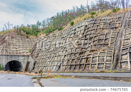 Concrete reinforcement of road, Wajima, Japan. 74675785