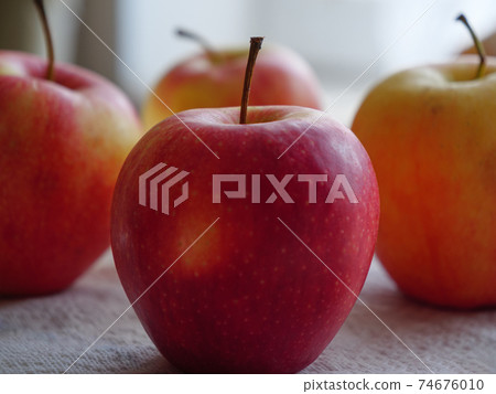 Fresh apples on the table close-up. Organic fruits. Fresh apples on the table close-up. Organic fruits. 74676010