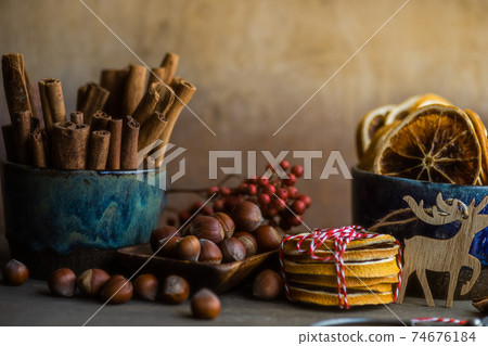 Milled or spiced wine or Gluehwein with oranges, anise star, cinnamon and berries on rustic wooden table with copy space Milled or spiced wine or Gluehwein with oranges, anise star, cinnamon and berries on rustic wooden table with copy space 74676184