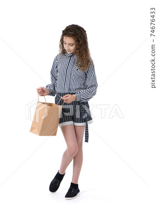 Child with a packet isolated on white Child with a packet isolated on white 74676433