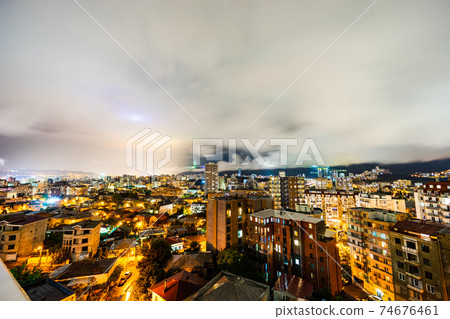 Dramatic sky with clouds at the raining night over Tbilisi's city centre, Georgia Dramatic sky with clouds at the raining night over Tbilisi's city centre, Georgia 74676461