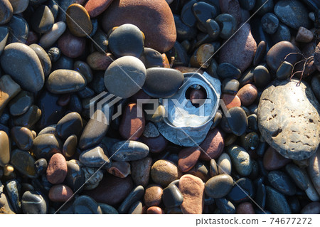 used tin can on the beach used tin can on the beach 74677272