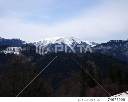 Sunny day in the mountains 74677906