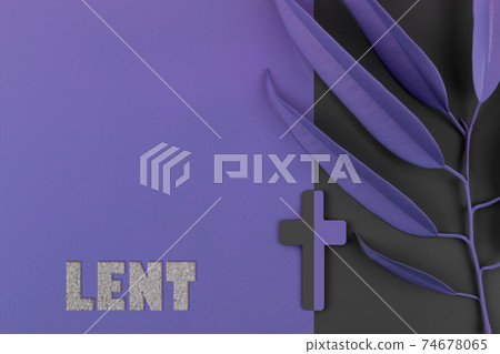 Catholic Cross with palm leaves on purple and gray background. 74678065