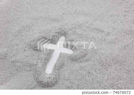 Christian cross drawing in ash as symbol of religion concept. 74678072