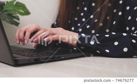Business woman college university student using laptop computer at desk, female hands typing on notebook keyboard studying working with pc technology online education concept on table, close up view Business woman college university student using laptop computer at desk, female hands typing on notebook keyboard studying working with pc technology online education concept on table, close up view 74679277