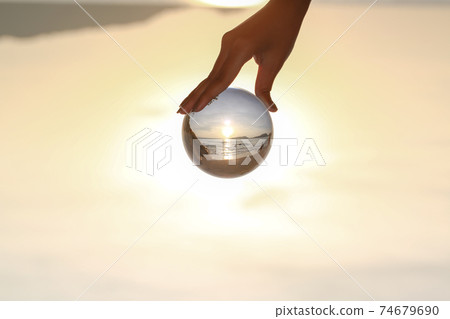 Catch the crystal ball with her finger Catch the crystal ball with her finger 74679690