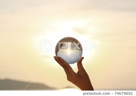 Catch the crystal ball with her finger Catch the crystal ball with her finger 74679692