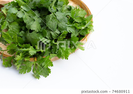 Fresh coriander on white background. Fresh coriander on white background. 74680911