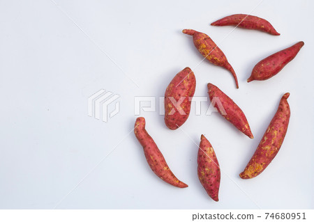 Sweet potato on white background. Top view 74680951