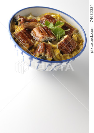 Photographed eel bowl with egg on eel kabayaki on a white background 74683324