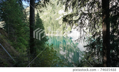 Kolsay lake among green hills and mountains. Kolsay lake among green hills and mountains. 74685488