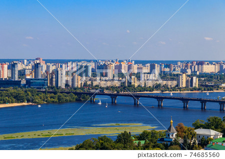 View of Paton bridge and left bank of the Dnieper river in Kiev, Ukraine View of Paton bridge and left bank of the Dnieper river in Kiev, Ukraine 74685560