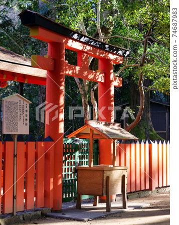 The torii gate of a bright vermilion shrine The torii gate of a bright vermilion shrine 74687983