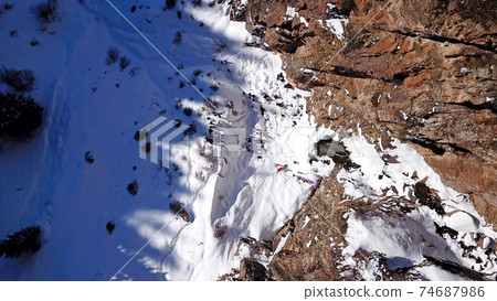 Freezing waterfall in the snowy mountains. Freezing waterfall in the snowy mountains. 74687986