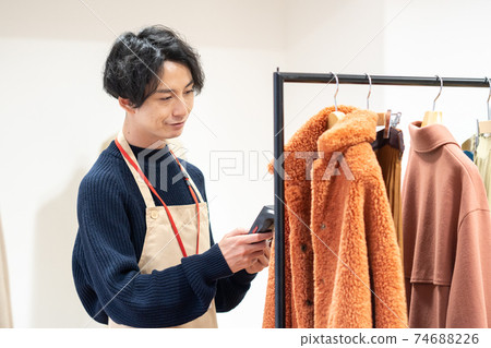 Apparel clerk who inspects and puts out goods 74688226