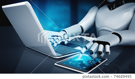 Robot humanoid use laptop and sit at table in future office 74689495