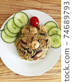 Asian cuisine-Homemade egg fried rice served with vegetables 74689793