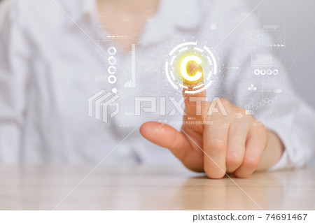 Copyright concept and hand pointing to an abstract sign with graphics. 74691467