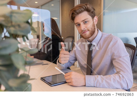 Office employees having a chat 74692863