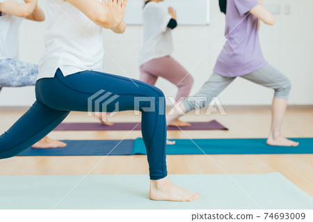 Women doing yoga, forest bathing, strength training, training, stretching 74693009
