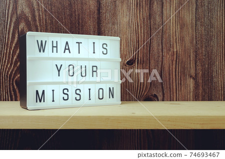 What is your Mission word in light box on wooden background 74693467