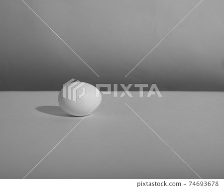 White single egg. Chicken egg with soft shadows on white background. Template for Easter holiday. 74693678