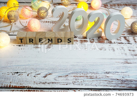 Trends 2020 word alphabet letters on wooden background 74693973