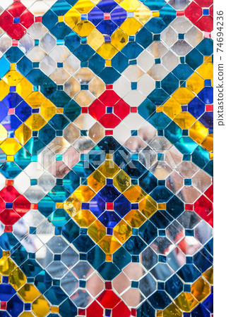 Wall pattern of mirrors and colored glass of Wat Phra Kaew, Grand Palace, Bangkok, Thailand, Asia Wall pattern of mirrors and colored glass of Wat Phra Kaew, Grand Palace, Bangkok, Thailand, Asia 74694236