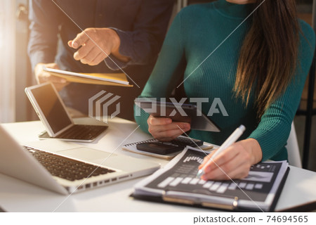 Project manager working and update tasks with milestones progress planning and photo professional investor working new start up project in the Office. Project manager working and update tasks with milestones progress planning and photo professional investor working new start up project in the Office. 74694565