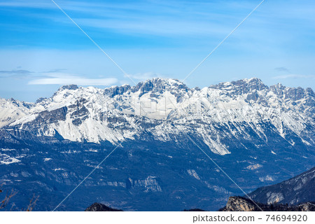 Brenta Dolomites in winter view from the Altopiano della Lessinia - Trentino Alto Adige Italy Brenta Dolomites in winter view from the Altopiano della Lessinia - Trentino Alto Adige Italy 74694920