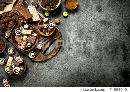 Chocolate sweets with cocoa powder. Chocolate sweets with cocoa powder. 74695049