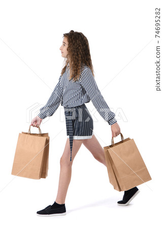 Child with a packet isolated on white Child with a packet isolated on white 74695282