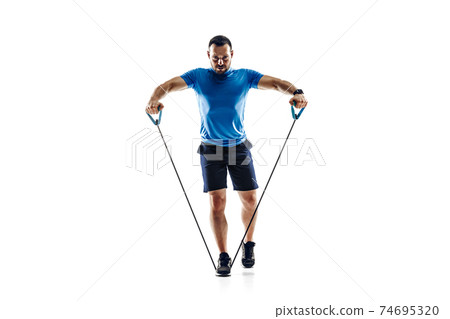 Caucasian professional male runner, athlete training isolated on white studio background. Copyspace for ad. Caucasian professional male runner, athlete training isolated on white studio background. Copyspace for ad. 74695320