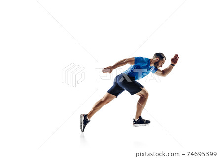 Caucasian professional male runner, athlete training isolated on white studio background. Copyspace for ad. 74695399