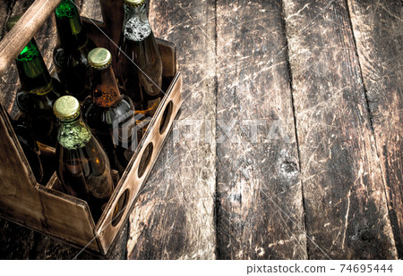 box with bottles of fresh beer. box with bottles of fresh beer. 74695444