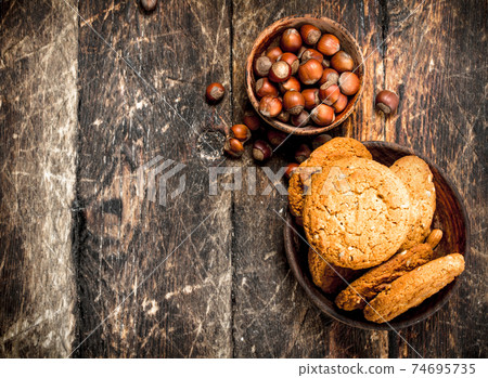 Oatmeal cookies with nuts. Oatmeal cookies with nuts. 74695735