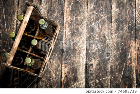 box with bottles of fresh beer. box with bottles of fresh beer. 74695739